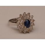 A 14ct white gold sapphire and diamond flowerhead ring,
