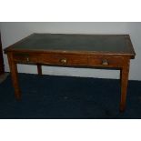 A vintage oak captains style desk, with plank top, above large drawer, flanked by a small drawer,