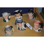 Six small Royal Doulton character jugs, comprising of the Wizard, Gladiator,