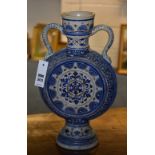 A German pottery moon shaped blue and white pottery vase by Mettlach,
