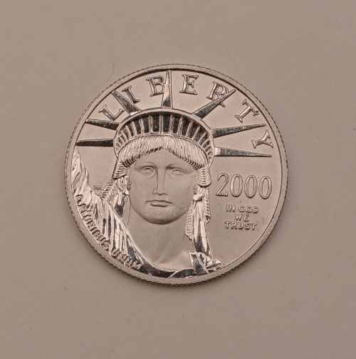 An American Millennium 50 dollar platinum coin, dated 2000, stamped .9995 Platinum 1/2 oz., 15.