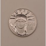 An American Millennium 50 dollar platinum coin, dated 2000, stamped .9995 Platinum 1/2 oz., 15.