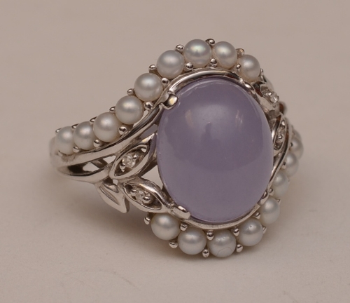 An 18ct white gold jade, pearl and diamond ring,