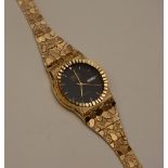 A Geneve Classic quartz watch fitted with 10ct gold bracelet,