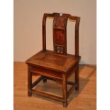 A late 19th/early 20th century Chinese hardwood low chair,