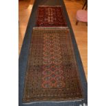 A Persian style rug, decorated with twelve rows of two gulls on brown ground with black border,