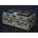 A Japanese cloisonne cigarette box, decorated with panels of dragons, blue enamel base,