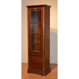 A reproduction cherry wood display cabinet by Willis and Gambier,