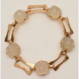 A yellow metal and white quartz bracelet, unstamped,