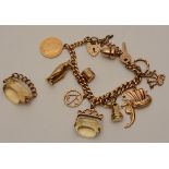 A 9ct gold charm bracelet, featuring a Victorian gold half sovereign dated 1895, 18cm circumference,