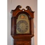 A 19th century mahogany inlaid eight day longcase clock, the hood with broken swan pediment,