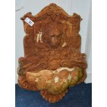 A cast iron fountain wall mount,