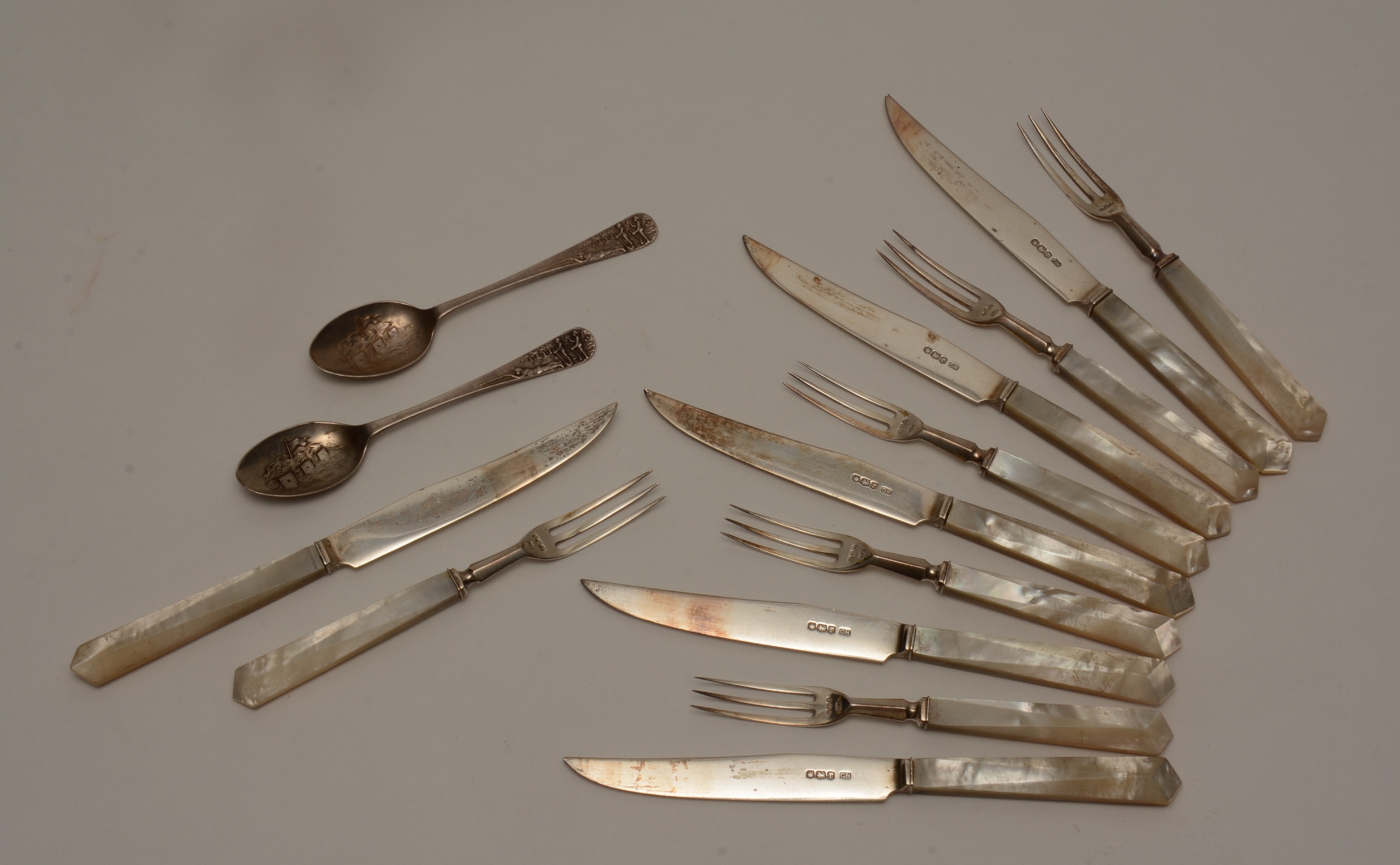 A set of six silver fruit knives and forks, hallmarks for Sheffield 1934-5,