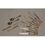 A set of six silver fruit knives and forks, hallmarks for Sheffield 1934-5,
