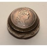 A French silver pill box, with hinged cover, inset with 18th century French coin to base,