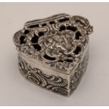 An Edwardian silver heart shaped pill box, hallmarks for William Comyns & Sons, London 1905,