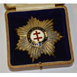 A Masonic silver star badge, with enamel double cross motif to centre,