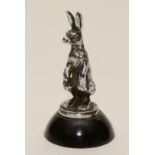 An Alvis chrome car mascot figure of a hare, circa 1930, raised on ebonised base,