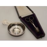 A silver wine taster, hallmarks for London 1970, together with a cased sewing set,