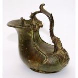 An antique patinated bronze Ascos ewer in the Etruscan style,