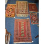 A collection of five small Eastern prayer mats, mainly of red design, 110 x 70cm, 70 x 51m,