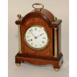 An Edwardian mahogany inlaid and brass mantel clock, with brass carry handle,