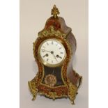 A French Louis XVI style boulle work clock, with red tortoiseshell and gilt metal mounts,