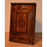 A George III oak corner cabinet circa 1800,