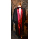 An Ede & Ravenscroft academic graduation robe and hood,