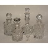 Four crystal decanters with stoppers,