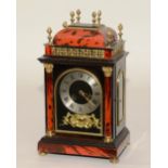 A French red faux tortoiseshell mantel clock,