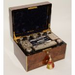 A Victorian silver and cut glass travelling vanity set in burr walnut case,