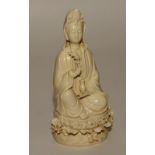 A 20th century Chinese blanc de chine figure of Guanyin, indistinct impressed marks to reverse,