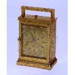 A French brass carriage clock, the dial with Roman numerals,