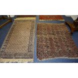 An Eastern rug, the cross motif centre on beige ground with multi spandrel dark brown border,