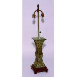 A Chinese archaic style patinated bronze vase, converted to lamp, with 1920's fittings,