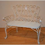 A painted metal garden bench, with slatted seat,