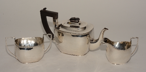 A silver teaset, hallmarks for Birmingham 1921/1924 SB&S, comprising of teapot, milk and sugar,