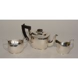 A silver teaset, hallmarks for Birmingham 1921/1924 SB&S, comprising of teapot, milk and sugar,