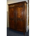 A late 18th/early 19th century French oak armoire,