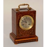 A 19th century French Rosewood inlaid mantel clock, with foliate designs and ormolu handle,