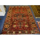 A Bakhtiar carpet, the three central diamonds over red ground,