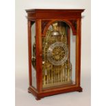 A fine brass twin fusee cathedral skeleton clock,