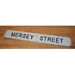 A vintage painted iron street sign named Mersey Street,