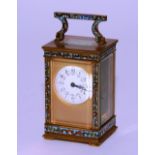 A late 19th century French champleve enamel and brass carriage clock,