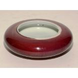 A Chinese Sang de Boef circular pot, with open top,