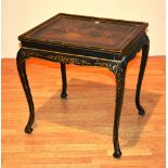 A mid 18th century black lacquered chinoiserie side table in the manner of Chippendale,