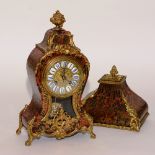A French Louis XVI style boulle work mantel clock, with original wall bracket,
