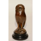 A bronze figure of an owl, signed Milo, on black plinth base,