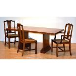 A 1950's walnut rectangular table with six walnut dining chairs, including two carvers,
